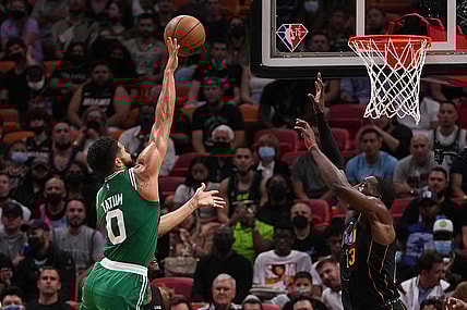 Nov 4, 2021; Miami, Florida, USA; Boston Celtics forward Jayson Tatum (0) shoots the ball against Miami Heat center Bam Adebayo (13) during the first half at FTX Arena. Mandatory Credit: Jasen Vinlove-USA TODAY Sports