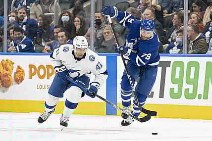 Nov 4, 2021; Toronto, Ontario, CAN; Toronto Maple Leafs defenseman T.J. Brodie (78) and Tampa Bay Lightning center Pierre-Edouard Bellemare (41) battle for the puck during the second period  at Scotiabank Arena. Mandatory Credit: Nick Turchiaro-USA TODAY Sports