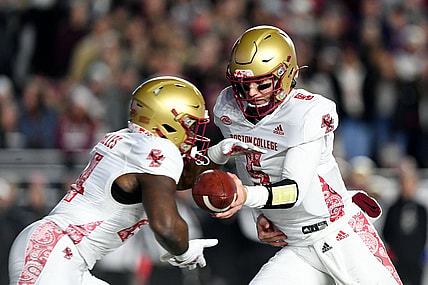 Nov 5, 2021; Chestnut Hill, Massachusetts, USA; Boston College Eagles quarterback Phil Jurkovec (5) hands the ball off to running back Pat Garwo III (24) during the first half at Alumni Stadium. Mandatory Credit: Brian Fluharty-USA TODAY Sports