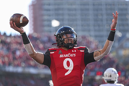 Nov 6, 2021; Cincinnati, Ohio, USA; Cincinnati Bearcats quarterback Desmond Ridder (9) reacts after scoring a touchdown against the Tulsa Golden Hurricane in the first half at Nippert Stadium. Mandatory Credit: Katie Stratman-USA TODAY Sports