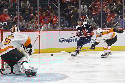 Nov 6, 2021; Washington, District of Columbia, USA; Washington Capitals right wing Tom Wilson (43) shoots the puck on Philadelphia Flyers goaltender Martin Jones (35) as Flyers defenseman Ivan Provorov (9) chases during the first period at Capital One Arena. Mandatory Credit: Geoff Burke-USA TODAY Sportsa