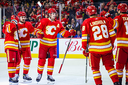 Nov 6, 2021; Calgary, Alberta, CAN; Calgary Flames center Sean Monahan (23) celebrates his goal with teammates against the New York Rangers during the first period at Scotiabank Saddledome. Mandatory Credit: Sergei Belski-USA TODAY Sports