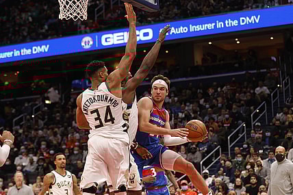 Nov 7, 2021; Washington, District of Columbia, USA; Washington Wizards forward Corey Kispert (24) leaps to pass the ball as Milwaukee Bucks forward Giannis Antetokounmpo (34) defends during the second quarter at Capital One Arena. Mandatory Credit: Geoff Burke-USA TODAY Sports
