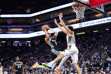 Nov 7, 2021; Sacramento, California, USA; Sacramento Kings guard Tyrese Haliburton (0) shoots the ball against Indiana Pacers guard Chris Duarte (3) during the second quarter at Golden 1 Center. Mandatory Credit: Kelley L Cox-USA TODAY Sports