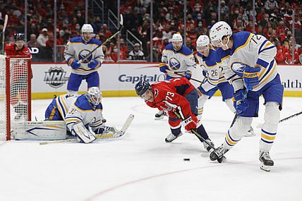 Nov 8, 2021; Washington, District of Columbia, USA; Washington Capitals left wing Conor Sheary (73) and Buffalo Sabres right wing Tage Thompson (72) battle for the puck in front of Sabres goaltender Dustin Tokarski (31) during the first period at Capital One Arena. Mandatory Credit: Geoff Burke-USA TODAY Sports