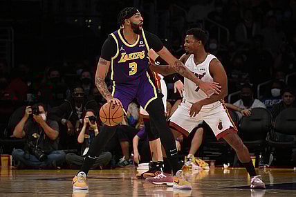Nov 10, 2021; Los Angeles, California, USA; Los Angeles Lakers forward Anthony Davis (3) moves the ball against Miami Heat guard Kyle Lowry (7) during the first half at Staples Center. Mandatory Credit: Richard Mackson-USA TODAY Sports