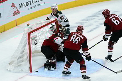 Nov 10, 2021; Glendale, Arizona, USA; Minnesota Wild left wing Kirill Kaprizov (97) scores a goal against the Arizona Coyotes during the second period at Gila River Arena. Mandatory Credit: Joe Camporeale-USA TODAY Sports
