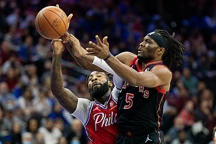 Nov 11, 2021; Philadelphia, Pennsylvania, USA; Toronto Raptors forward Precious Achiuwa (5) and Philadelphia 76ers center Andre Drummond (1) battle for a rebound during the second quarter at Wells Fargo Center. Mandatory Credit: Bill Streicher-USA TODAY Sports