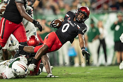 Nov 12, 2021; Tampa, Florida, USA; Cincinnati Bearcats running back Charles McClelland (0) runs with the ball in the second quarter against the South Florida Bulls at Raymond James Stadium. Mandatory Credit: Jeremy Reper-USA TODAY Sports