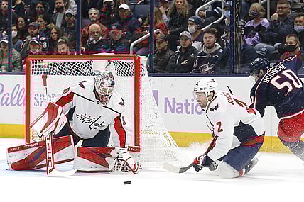 Nov 12, 2021; Columbus, Ohio, USA; Washington Capitals goalie Ilya Samsonov (30) tracks the rebound of a Columbus Blue Jackets left wing Eric Robinson (50) shot during the first period at Nationwide Arena. Mandatory Credit: Russell LaBounty-USA TODAY Sports