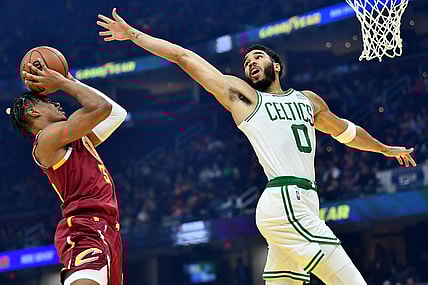 Nov 13, 2021; Cleveland, Ohio, USA; Cleveland Cavaliers forward Isaac Okoro (35) shoots against Boston Celtics forward Jayson Tatum (0) during the first quarter at Rocket Mortgage FieldHouse. Mandatory Credit: Ken Blaze-USA TODAY Sports