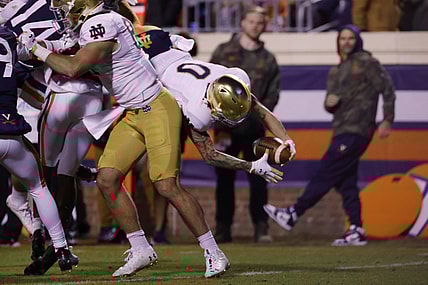 Nov 13, 2021; Charlottesville, Virginia, USA; Notre Dame Fighting Irish wide receiver Braden Lenzy (0) scorers a touchdown against the Virginia Cavaliers during the first quarter at Scott Stadium. Mandatory Credit: Geoff Burke-USA TODAY Sportsa