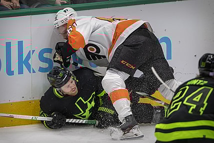Nov 13, 2021; Dallas, Texas, USA; Philadelphia Flyers defenseman Justin Braun (61) checks Dallas Stars center Joe Pavelski (16) during the first period at the American Airlines Center. Mandatory Credit: Jerome Miron-USA TODAY Sports