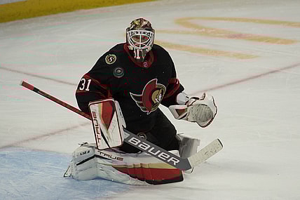 Nov 14, 2021; Ottawa, Ontario, CAN; Ottawa Senators goalie Anton Forsberg (31) makes a save in the third period against the Calgary Flames at the Canadian Tire Centre. Mandatory Credit: Marc DesRosiers-USA TODAY Sports