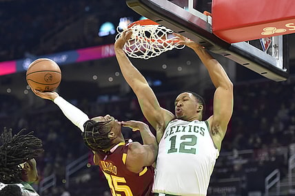 Nov 15, 2021; Cleveland, Ohio, USA; Boston Celtics forward Grant Williams (12) defends a shot by Cleveland Cavaliers forward Isaac Okoro (35) in the second quarter at Rocket Mortgage FieldHouse. Mandatory Credit: David Richard-USA TODAY Sports