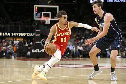 Nov 15, 2021; Atlanta, Georgia, USA; Atlanta Hawks guard Trae Young (11) is defended by Orlando Magic forward Franz Wagner (22) in the second quarter at State Farm Arena. Mandatory Credit: Brett Davis-USA TODAY Sports
