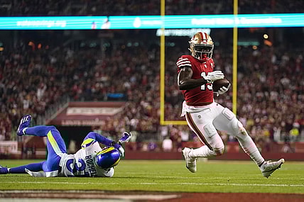 Nov 15, 2021; Santa Clara, California, USA; San Francisco 49ers wide receiver Deebo Samuel (19) runs for a touchdown past Los Angeles Rams cornerback Robert Rochell (31) in the second quarter at Levi's Stadium. Mandatory Credit: Cary Edmondson-USA TODAY Sports