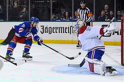 Nov 16, 2021; New York, New York, USA; New York Rangers left wing Chris Kreider (20) shots the puck and scores against Montreal Canadiens goaltender Cayden Primeau (30) during the second period at Madison Square Garden. Mandatory Credit: Dennis Schneidler-USA TODAY Sports