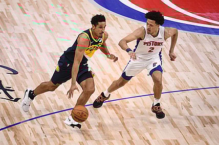 Nov 17, 2021; Detroit, Michigan, USA; Indiana Pacers guard Malcolm Brogdon (7) drives to the basket as Detroit Pistons guard Cade Cunningham (2) defends during the second quarter at Little Caesars Arena. Mandatory Credit: Tim Fuller-USA TODAY Sports