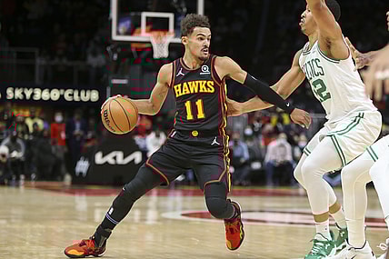 Nov 17, 2021; Atlanta, Georgia, USA; Atlanta Hawks guard Trae Young (11) is defended by Boston Celtics forward Grant Williams (12) in the first quarter at State Farm Arena. Mandatory Credit: Brett Davis-USA TODAY Sports