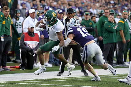 Nov 20, 2021; Manhattan, Kansas, USA; Baylor Bears running back Trestan Ebner (1) is pushed out of bounds by Kansas State Wildcats defensive back Ross Elder (19) during the first quarter at Bill Snyder Family Football Stadium. Mandatory Credit: Scott Sewell-USA TODAY Sports