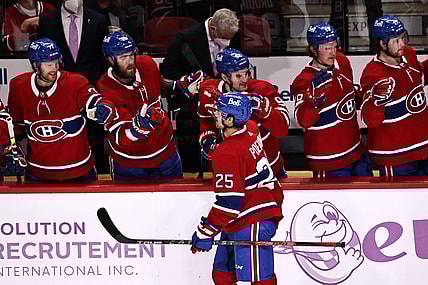Nov 20, 2021; Montreal, Quebec, CAN; Montreal Canadiens center Ryan Poehling (25) celebrates his goal against Nashville Predators with teammates during the second period at Bell Centre. Mandatory Credit: Jean-Yves Ahern-USA TODAY Sports