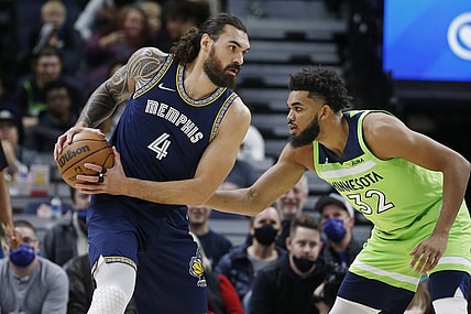 Nov 20, 2021; Minneapolis, Minnesota, USA; Minnesota Timberwolves center Karl-Anthony Towns (32) defends against Memphis Grizzlies center Steven Adams (4) in the first quarter at Target Center. Mandatory Credit: Bruce Kluckhohn-USA TODAY Sports