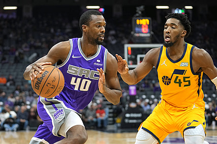 Nov 20, 2021; Sacramento, California, USA; Sacramento Kings forward Harrison Barnes (40) drives while being defended by Utah Jazz guard Donovan Mitchell (45) during the first quarter at Golden 1 Center. Mandatory Credit: Darren Yamashita-USA TODAY Sports