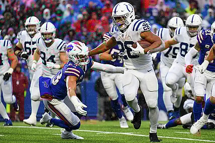 Nov 21, 2021; Orchard Park, New York, USA; Indianapolis Colts running back Jonathan Taylor (28) stiff-arms Buffalo Bills safety Micah Hyde (23) on a run during the second half at Highmark Stadium. Mandatory Credit: Rich Barnes-USA TODAY Sports