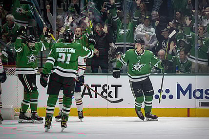 Nov 23, 2021; Dallas, Texas, USA; Dallas Stars right wing Alexander Radulov (47) and left wing Jason Robertson (21) and left wing Roope Hintz (24) celebrate a power play goal by Roope Hintz during the first period against the Edmonton Oilers at the American Airlines Center. Mandatory Credit: Jerome Miron-USA TODAY Sports