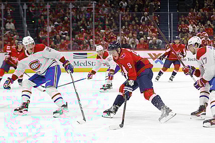 Nov 24, 2021; Washington, District of Columbia, USA; Washington Capitals defenseman Dmitry Orlov (9) skates with the puck as Montreal Canadiens defenseman Jeff Petry (26) during the first period at Capital One Arena. Mandatory Credit: Geoff Burke-USA TODAY Sports