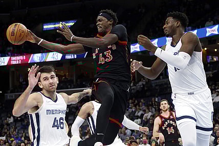 Nov 24, 2021; Memphis, Tennessee, USA; Toronto Raptors forward Pascal Siakam (43) passes the ball as Memphis Grizzles forward Jaren Jackson Jr. (13) defends during the first half at FedExForum. Mandatory Credit: Petre Thomas-USA TODAY Sports