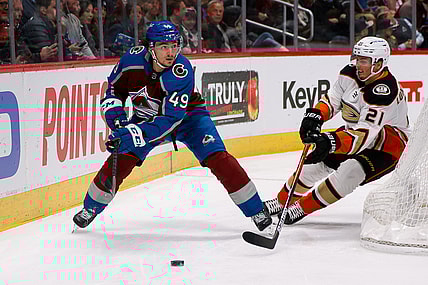 Nov 24, 2021; Denver, Colorado, USA; Colorado Avalanche defenseman Samuel Girard (49) controls the puck ahead of Anaheim Ducks center Isac Lundestrom (21) in the first period at Ball Arena. Mandatory Credit: Isaiah J. Downing-USA TODAY Sports
