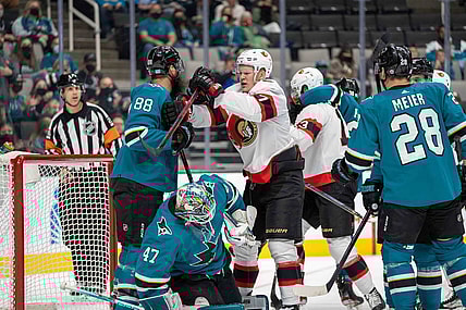 Nov 24, 2021; San Jose, California, USA;  San Jose Sharks defenseman Brent Burns (88) and Ottawa Senators left wing Brady Tkachuk (7) fight in front of the net during the first period at SAP Center at San Jose. Mandatory Credit: Neville E. Guard-USA TODAY Sports