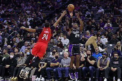 Nov 24, 2021; Sacramento, California, USA; Sacramento Kings guard Buddy Hield (24) shoots the ball over Portland Trail Blazers forward Norman Powell (24) during the fourth quarter at Golden 1 Center. Mandatory Credit: Sergio Estrada-USA TODAY Sports