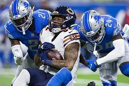 Nov 25, 2021; Detroit, Michigan, USA; Chicago Bears running back David Montgomery (32) gets tackeld by Detroit Lions cornerback Amani Oruwariye (24) and free safety Tracy Walker III (21) during the first quarter at Ford Field. Mandatory Credit: Raj Mehta-USA TODAY Sports