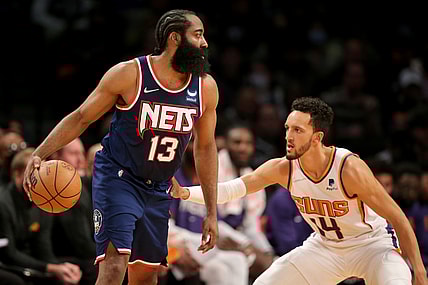 Nov 27, 2021; Brooklyn, New York, USA; Brooklyn Nets guard James Harden (13) controls the ball against Phoenix Suns guard Landry Shamet (14) during the second quarter at Barclays Center. Mandatory Credit: Brad Penner-USA TODAY Sports