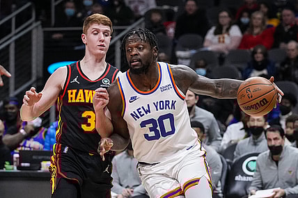 Nov 27, 2021; Atlanta, Georgia, USA; New York Knicks forward Julius Randle (30) dribbles against Atlanta Hawks guard Kevin Huerter (3) during the first half at State Farm Arena. Mandatory Credit: Dale Zanine-USA TODAY Sports