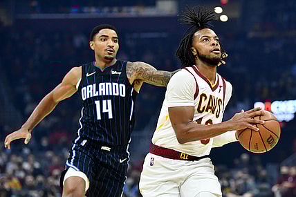 Nov 27, 2021; Cleveland, Ohio, USA; Cleveland Cavaliers guard Darius Garland (10) drives to the basket against Orlando Magic guard Gary Harris (14) during the first half at Rocket Mortgage FieldHouse. Mandatory Credit: Ken Blaze-USA TODAY Sports