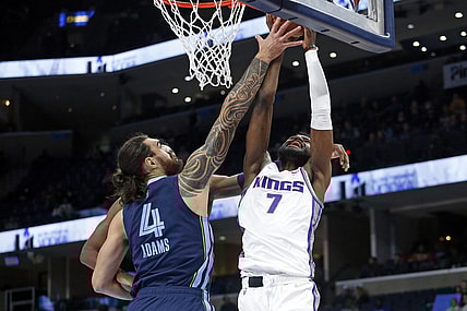 Nov 28, 2021; Memphis, Tennessee, USA; Sacramento Kings forward-center Chimezie Metu (7) shoots as Memphis Grizzles center Steven Adams (4) defends during the first half at FedExForum. Mandatory Credit: Petre Thomas-USA TODAY Sports