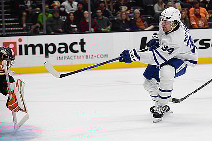 Nov 28, 2021; Anaheim, California, USA; Toronto Maple Leafs center Auston Matthews (34) shoots on goal against Anaheim Ducks goaltender John Gibson (36) during the second period at Honda Center. Mandatory Credit: Gary A. Vasquez-USA TODAY Sports