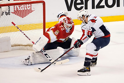 Nov 30, 2021; Sunrise, Florida, USA; Washington Capitals center Nic Dowd (26) takes a shot on Florida Panthers goaltender Sergei Bobrovsky (72) during the second period at FLA Live Arena. Mandatory Credit: Jasen Vinlove-USA TODAY Sports