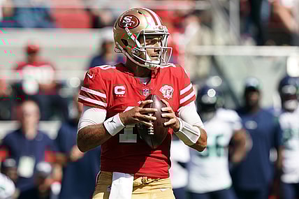 Oct 3, 2021; Santa Clara, California, USA; San Francisco 49ers quarterback Jimmy Garoppolo (10) throws a pass during the second quarter against the Seattle Seahawks at Levi's Stadium. Mandatory Credit: Darren Yamashita-USA TODAY Sports