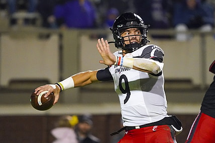 Nov 26, 2021; Greenville, North Carolina, USA; Cincinnati Bearcats quarterback Desmond Ridder (9) throws the ball during the second half against the East Carolina Pirates at Dowdy-Ficklen Stadium. Mandatory Credit: James Guillory-USA TODAY Sports