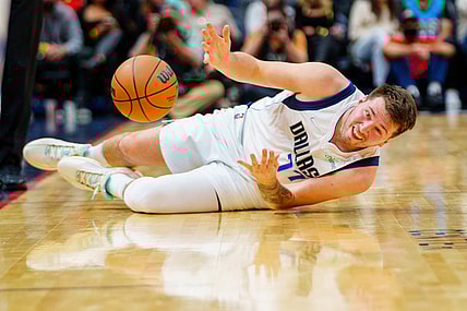 Dec 1, 2021; New Orleans, Louisiana, USA; Dallas Mavericks Point Guard Luka Doncic (77) drops the ball in the second quarter at Smoothie King Center. Mandatory Credit: Andrew Wevers-USA TODAY Sports