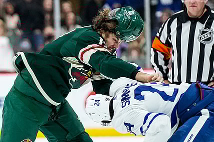 Dec 4, 2021; Saint Paul, Minnesota, USA; Minnesota Wild forward Marcus Foligno (17) fights Toronto Maple Leafs forward Wayne Simmonds (24) during the first period at Xcel Energy Center. Mandatory Credit: Brace Hemmelgarn-USA TODAY Sports