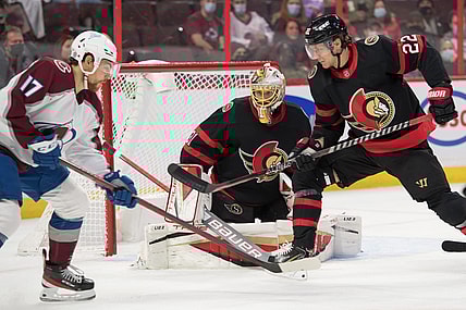 Dec 4, 2021; Ottawa, Ontario, CAN; Colorado Avalanche center Tyson Jost (17) battles with Ottawa Senators defenseman Nikita Zaitsev (22) in the first period at the Canadian Tire Centre. Mandatory Credit: Marc DesRosiers-USA TODAY Sports