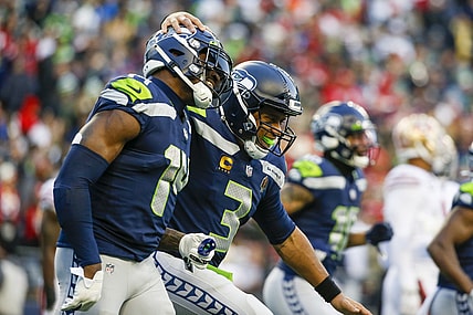 Dec 5, 2021; Seattle, Washington, USA; Seattle Seahawks quarterback Russell Wilson (3) celebrates with wide receiver DK Metcalf (14) after throwing a touchdown pass against the San Francisco 49ers during the third quarter at Lumen Field. Mandatory Credit: Joe Nicholson-USA TODAY Sports