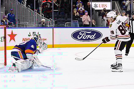 Dec 5, 2021; Elmont, New York, USA; Chicago Blackhawks right wing Patrick Kane (88) scores the wining goal on New York Islanders goaltender Semyon Varlamov (40) during shootouts  at UBS Arena. Mandatory Credit: Dennis Schneidler-USA TODAY Sports