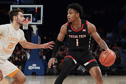 Dec 7, 2021; New York, New York, USA; Texas Tech Red Raiders guard Terrence Shannon Jr. (1) dribbles as Tennessee Volunteers guard Santiago Vescovi (25) defends during the second half at Madison Square Garden. Mandatory Credit: Vincent Carchietta-USA TODAY Sports